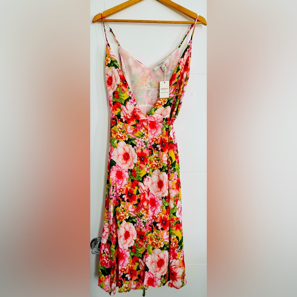 Summer Ready Sleeveless Calf-length wrap around dress. Never worn NWT!